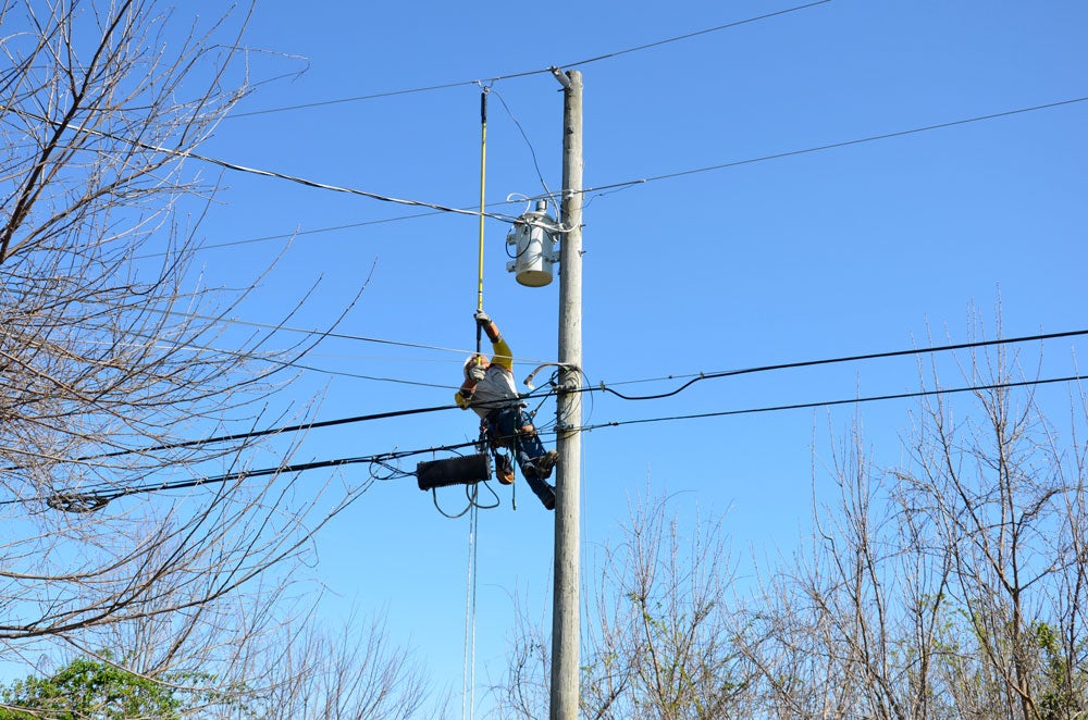 linemen on pole